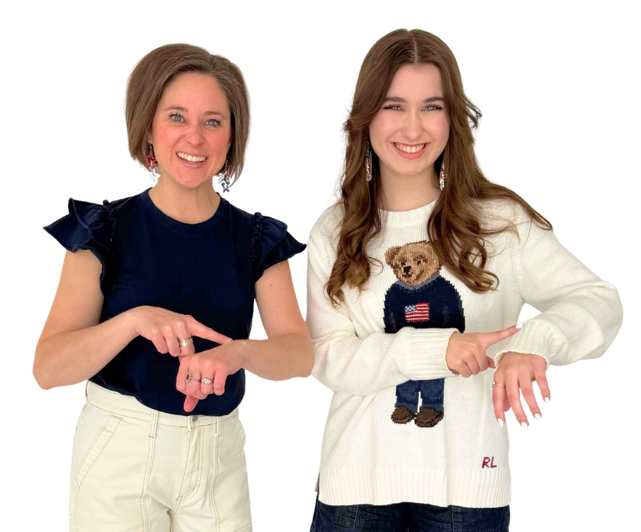 Emma and Sarah pointing to their watches, signaling it's time to try metal-free earrings for sensitive ears