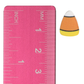 Candy corn stud earring beside an inch and centimeter ruler for size reference
