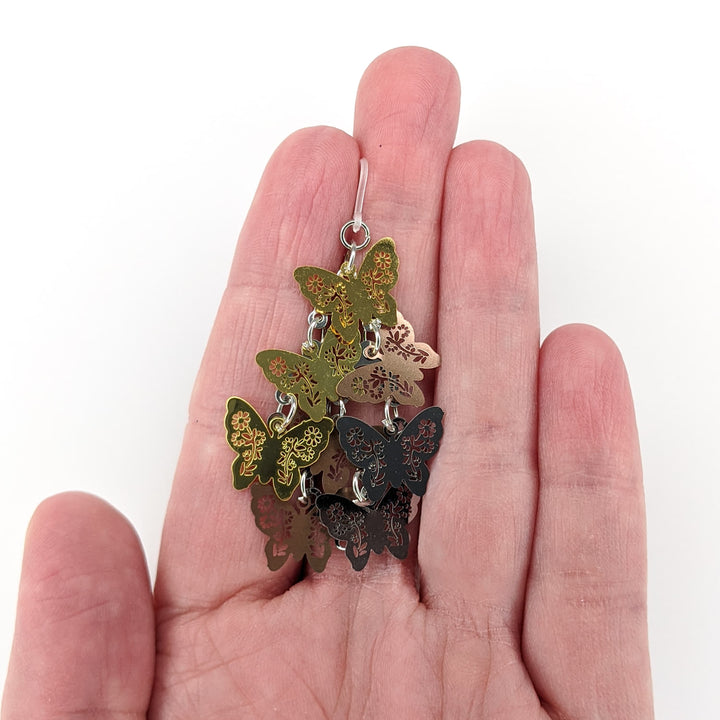 Cascading Butterfly Earrings (Dangles) - metallic - size comparison hand
