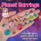 Ringed Planet Earrings (Dangles) - size comparison hand