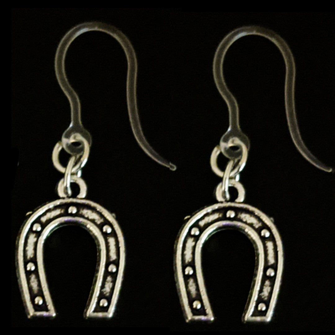 Silver Horseshoe Earrings (Dangles) - size comparison quarter