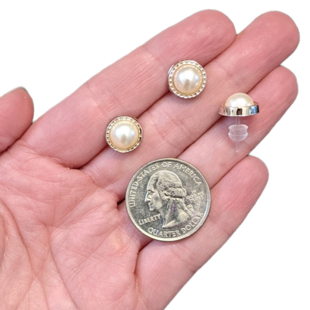 Minimalist Gold Rimmed Pearl Earrings (Studs) - size comparison quarter & hand