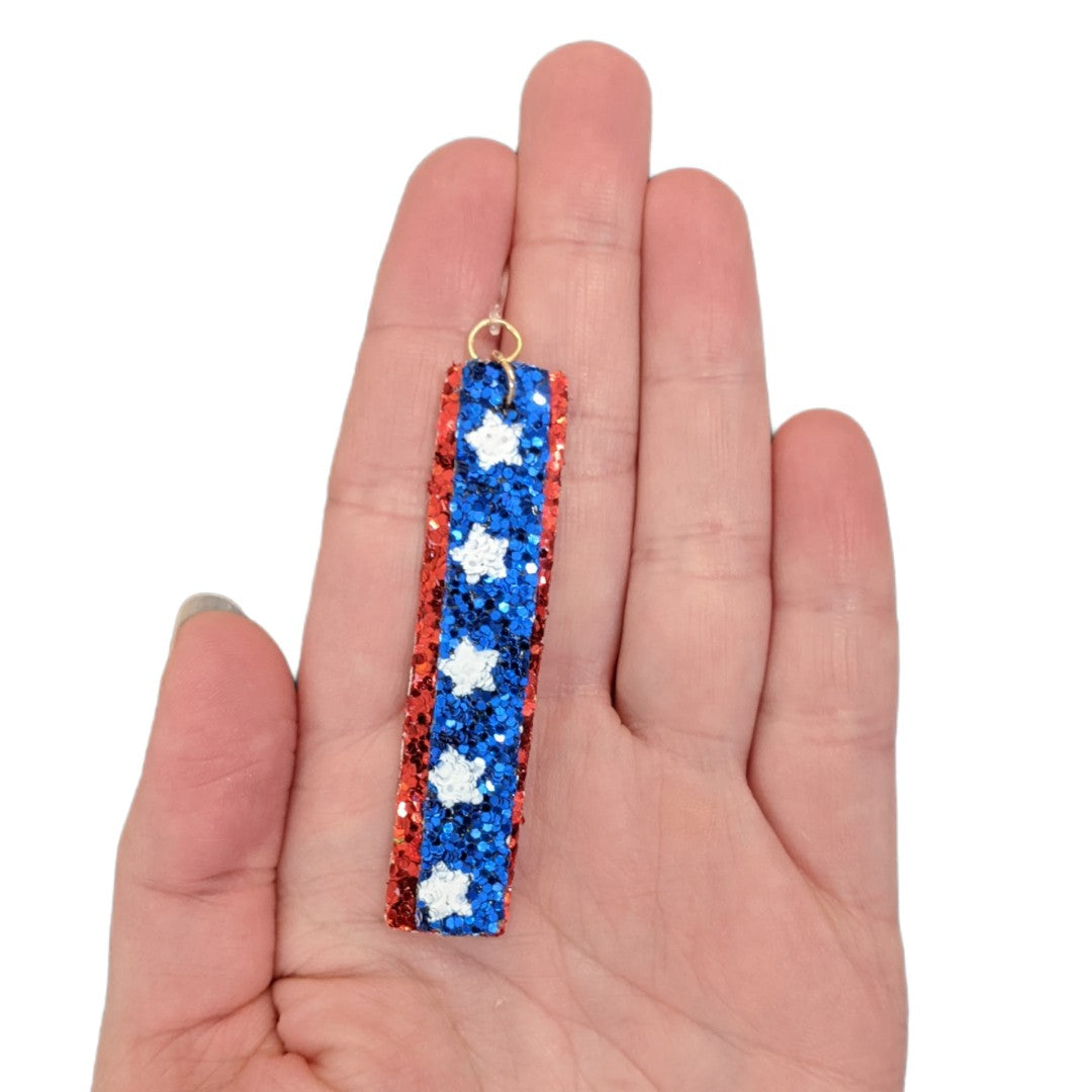 Glitter America Earrings (Dangles) - double layer strip - size comparison hand