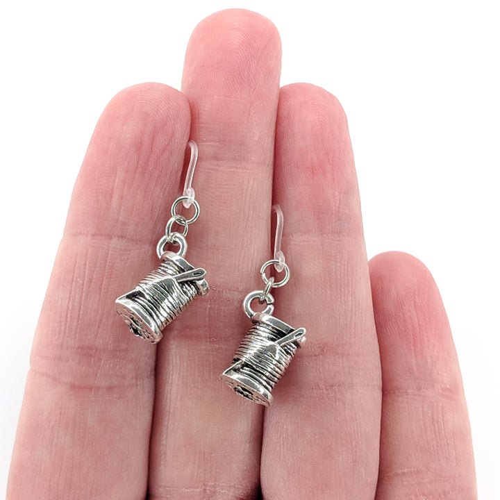 Spool of Thread Earrings (Dangles) - size comparison hand
