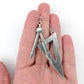 Exaggerated Math Tool Earrings (Dangles) - size comparison hand