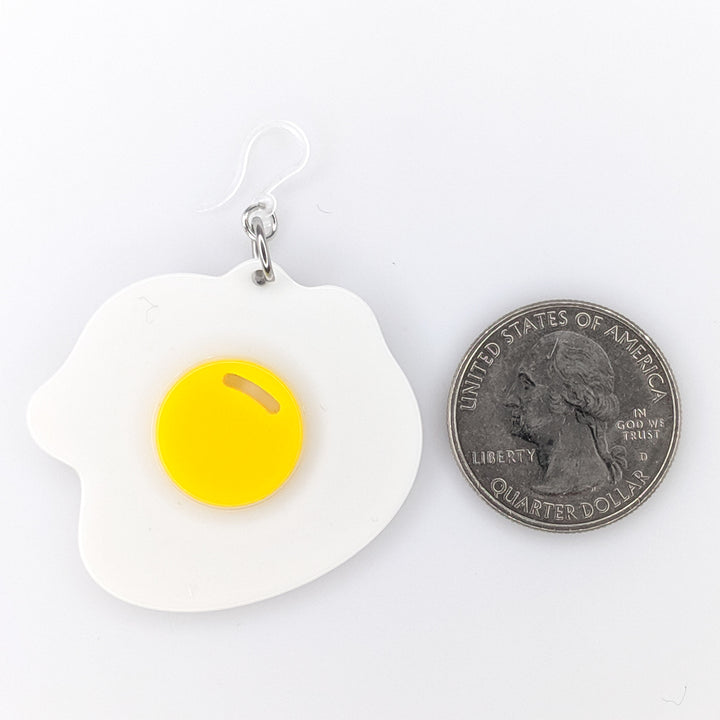 Exaggerated Fried Egg Earrings (Dangles) - size comparison quarter