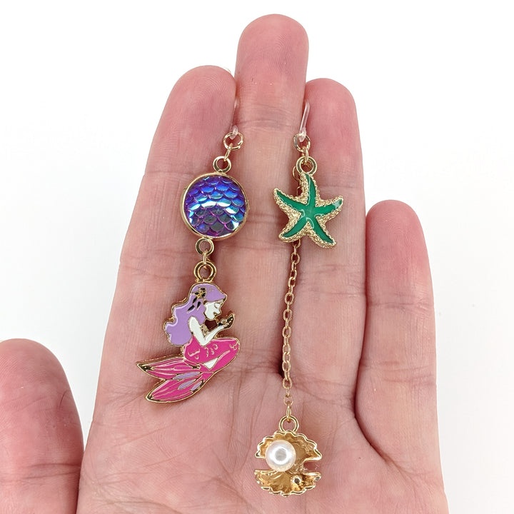 Under the Sea Earrings (Dangles) - size comparison hand