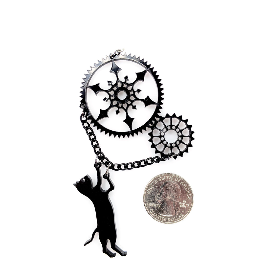 Exaggerated Gear Cat Earrings (Dangles) - size comparison quarter