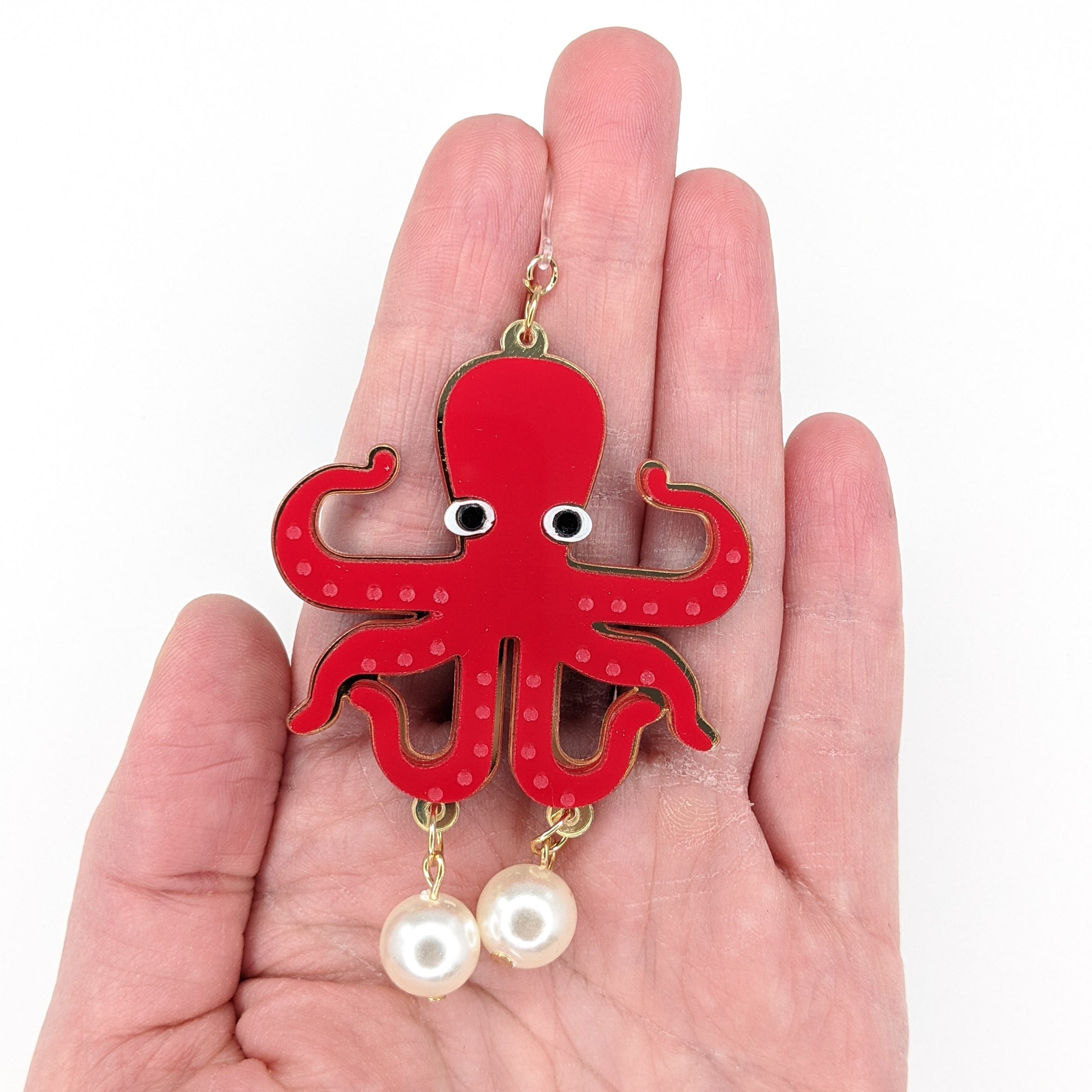 Exaggerated Pearl Octopus Earrings (Dangles) - size comparison hand
