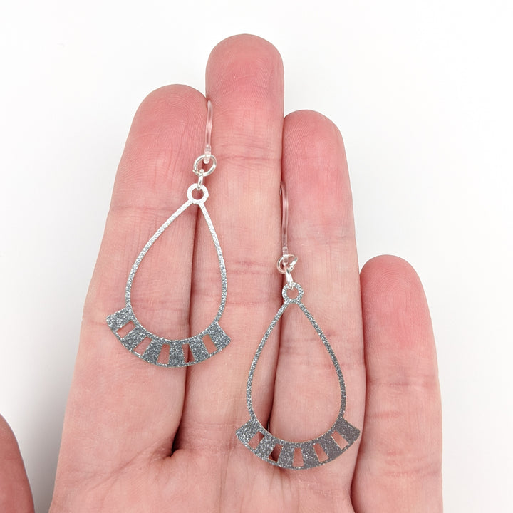 Silver Necklace Earrings (Dangles) - size comparison hand