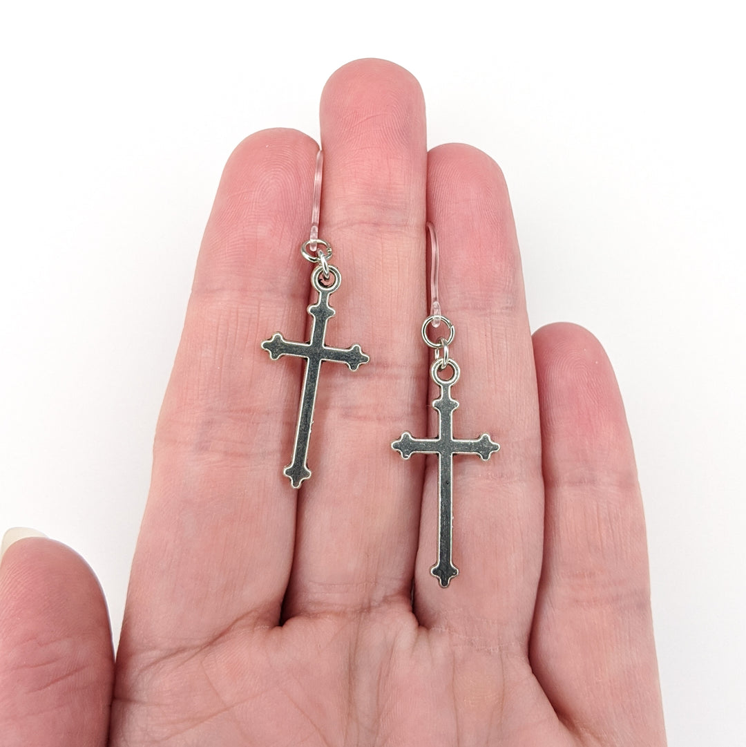 Decorative Silver Cross Earrings (Dangles) - size comparison hand