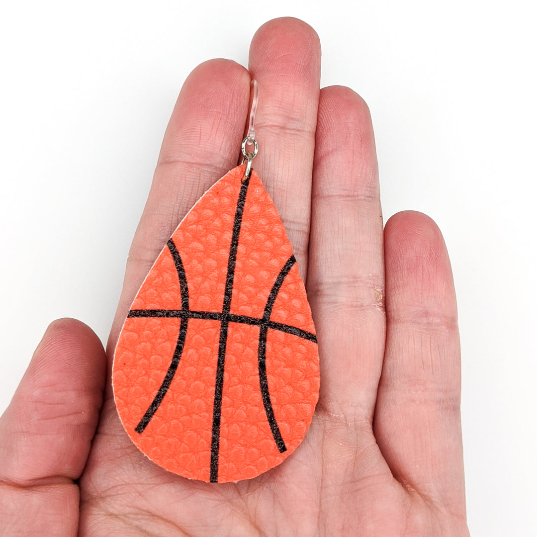 Basketball Skin Earrings (Teardrop Dangles) - size comparison hand