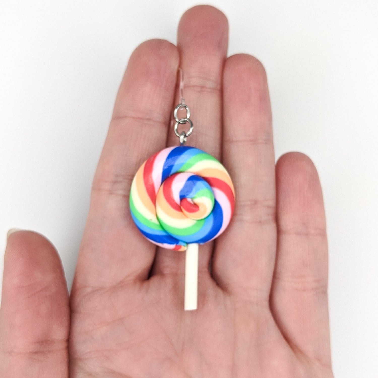 Exaggerated Lollipop Earrings (Dangles) - size comparison hand