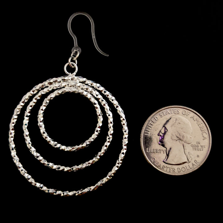 Silver Stacked Hoop Earrings (Dangles) - size comparison quarter