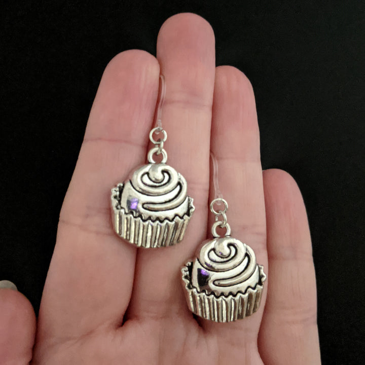 Silver Cupcake Earrings (Dangles) - large - size comparison hand