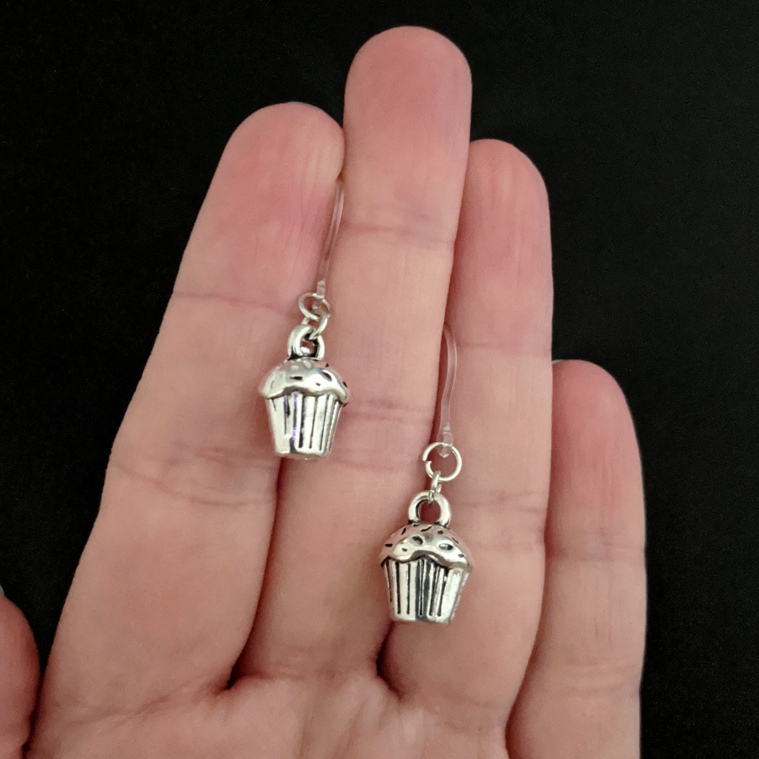 Silver Cupcake Earrings (Dangles) - small - size comparison hand