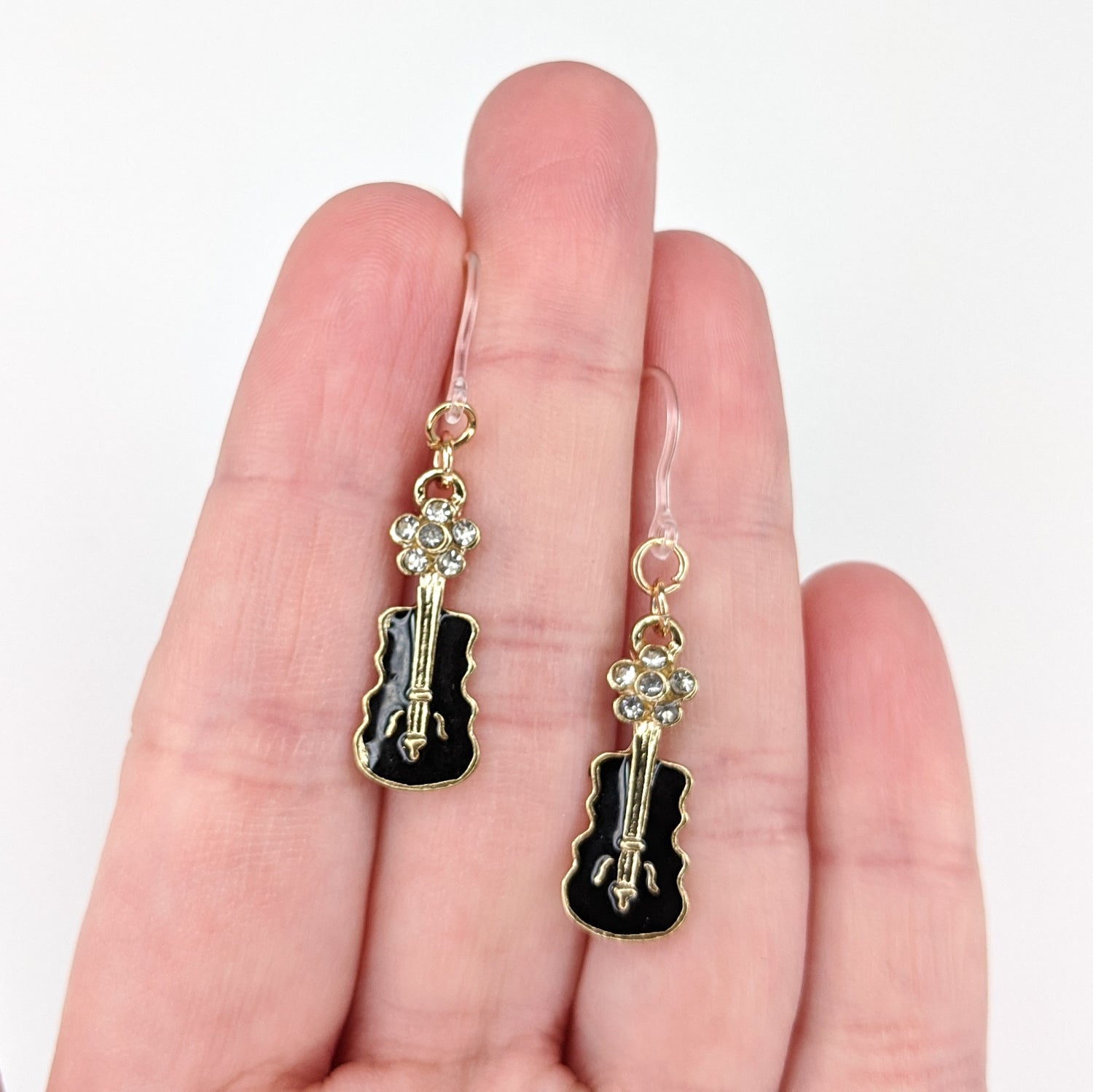 Jeweled Guitar Earrings (Dangles) - size comparison hand