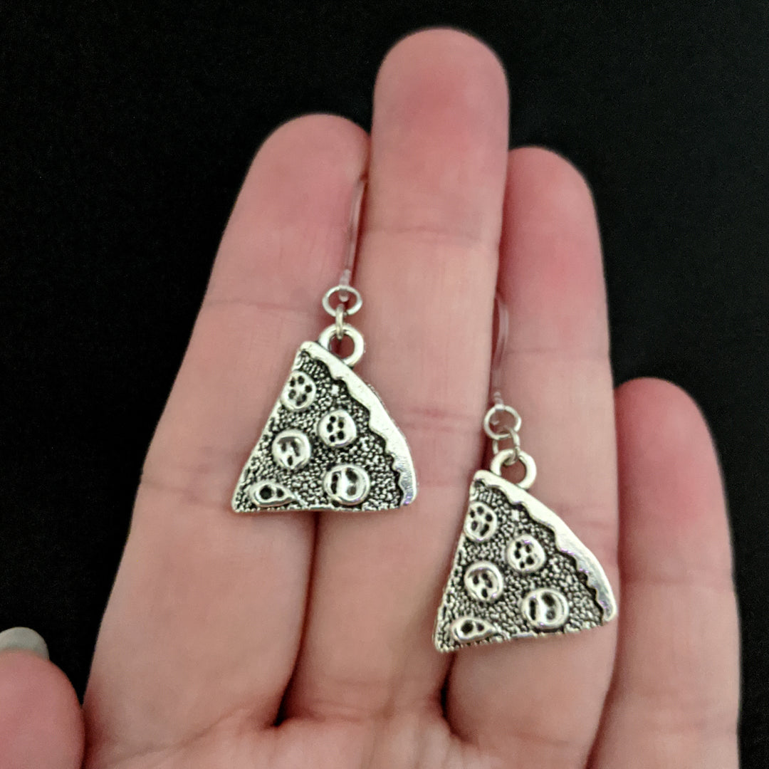Silver Pizza Earrings (Dangles) - size comparison hand
