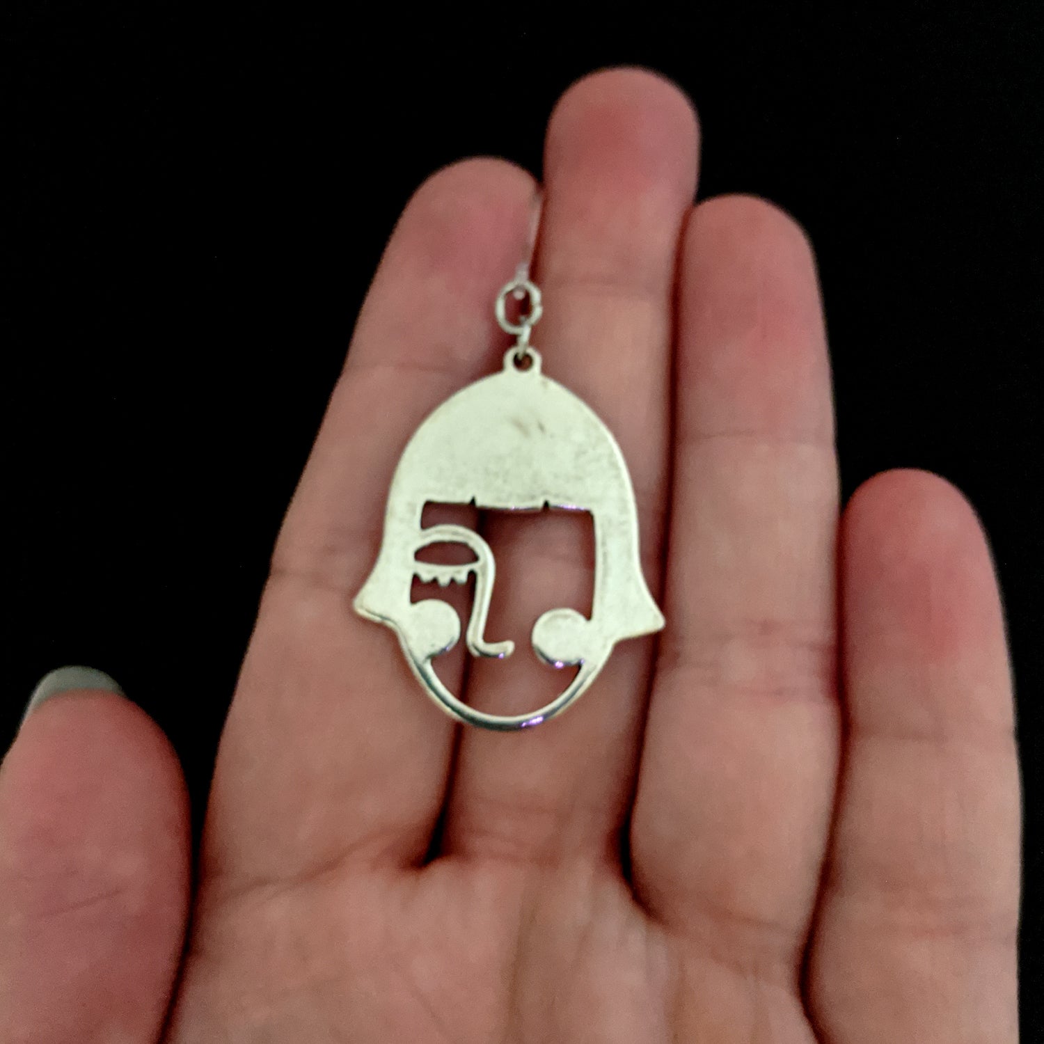 Picasso Earrings (Dangles) - size comparison hand