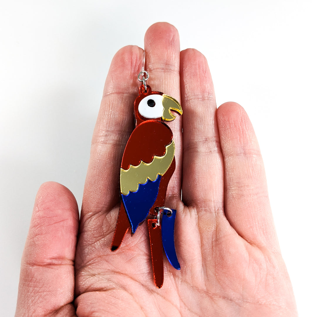 Exaggerated Parrot Earrings (Dangles) - size comparison hand