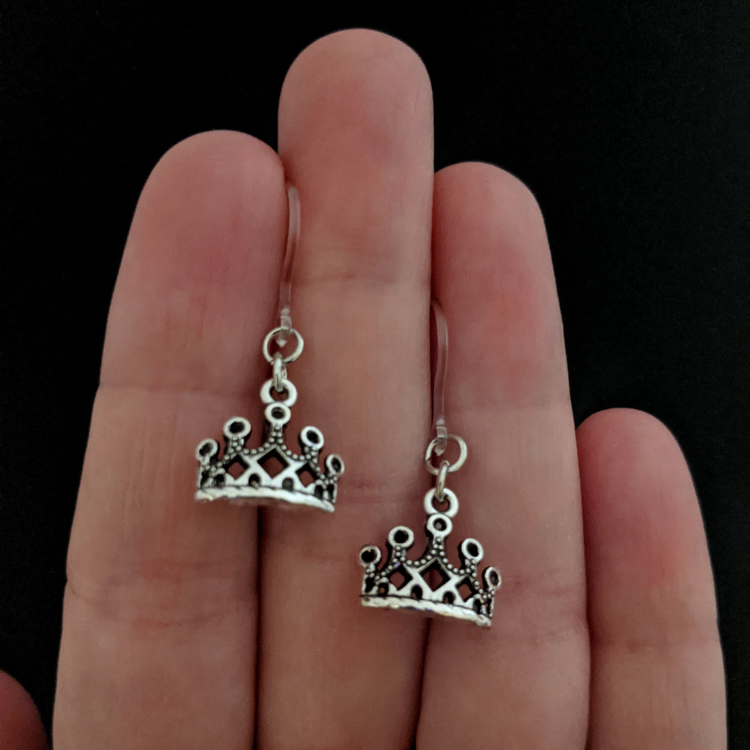 Silver Crown Earrings (Dangles) - size comparison hand