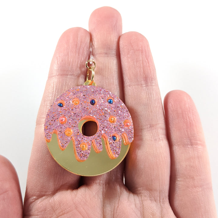 Exaggerated Donut Earrings (Dangles) - size comparison hand