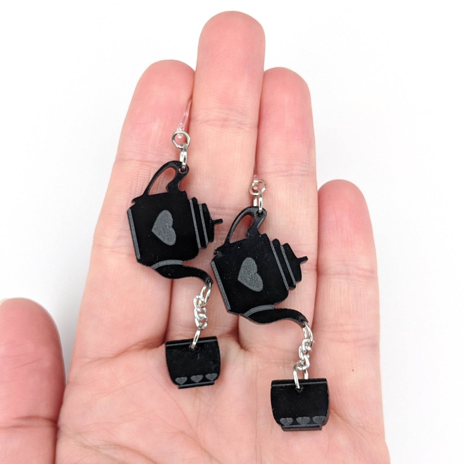 Exaggerated Tea Earrings (Dangles) - size comparison hand