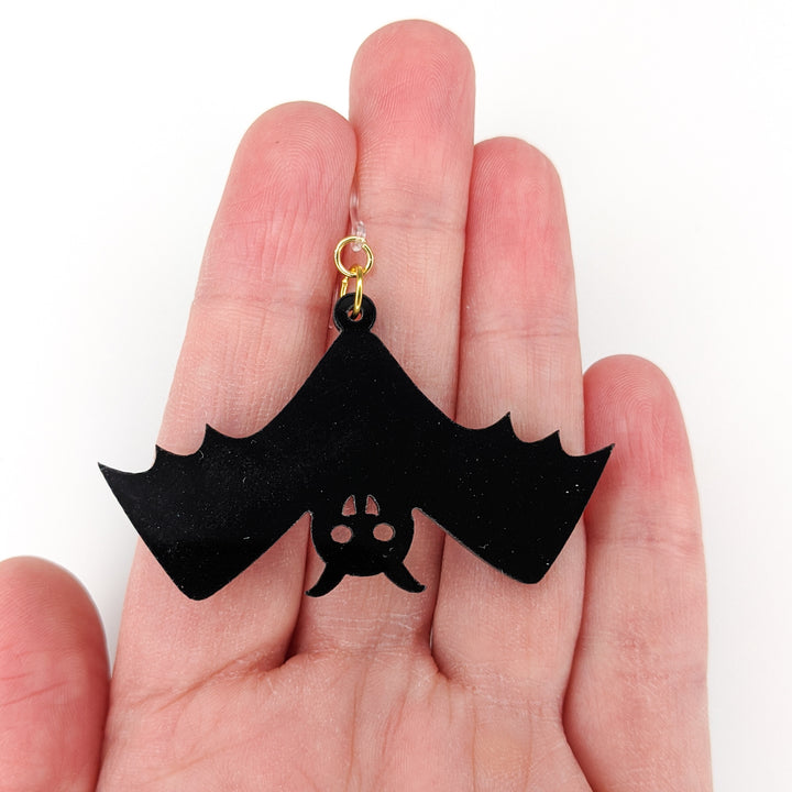 Exaggerated Bat Earrings (Dangles) - size comparison hand