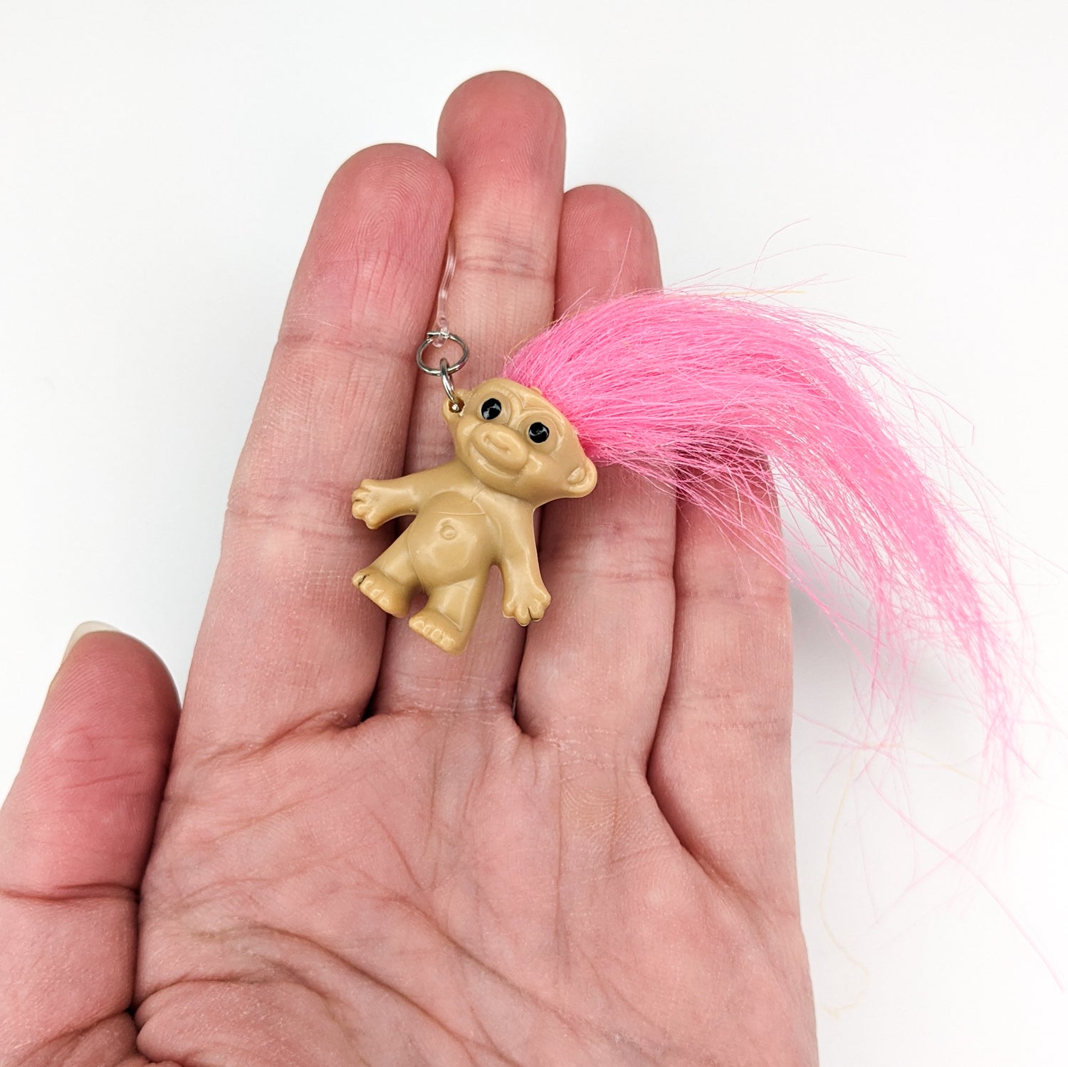 Exaggerated Troll Earrings (Dangles) - size comparison hand