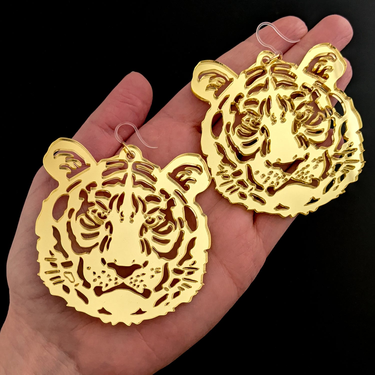 Exaggerated Tiger Earrings (Dangles) - size comparison hand