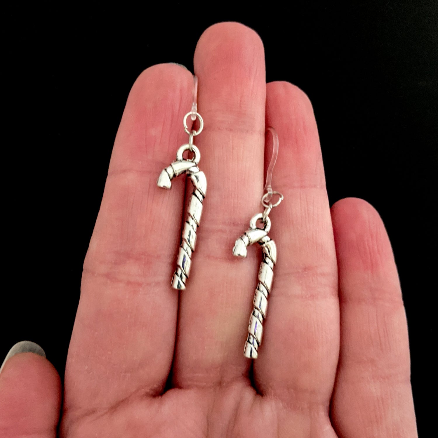 Silver Candy Cane Earrings (Dangles) - size comparison hand