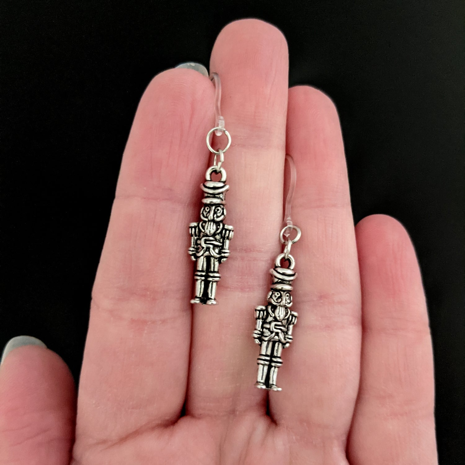 Silver Nutcracker Earrings (Dangles) - freestanding nutcracker - size comparison hand