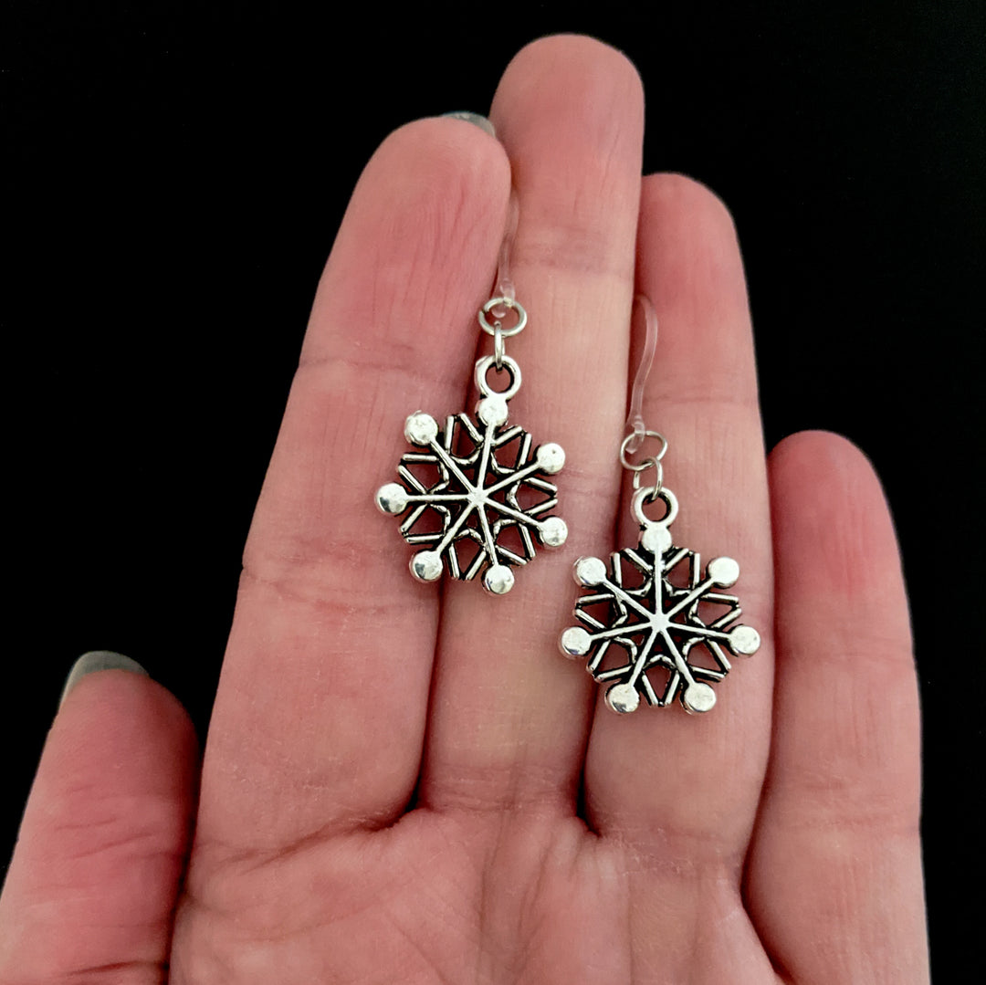 Silver Snowflake Earrings (Dangles) - size comparison hand