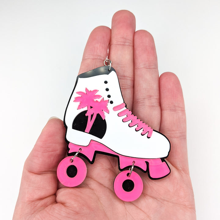 Exaggerated Roller Skate Earrings (Dangles) - size comparison hand