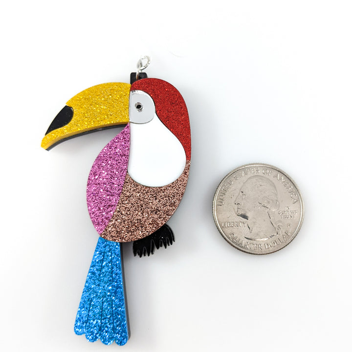 Exaggerated Toucan Earrings (Dangles) - size comparison quarter