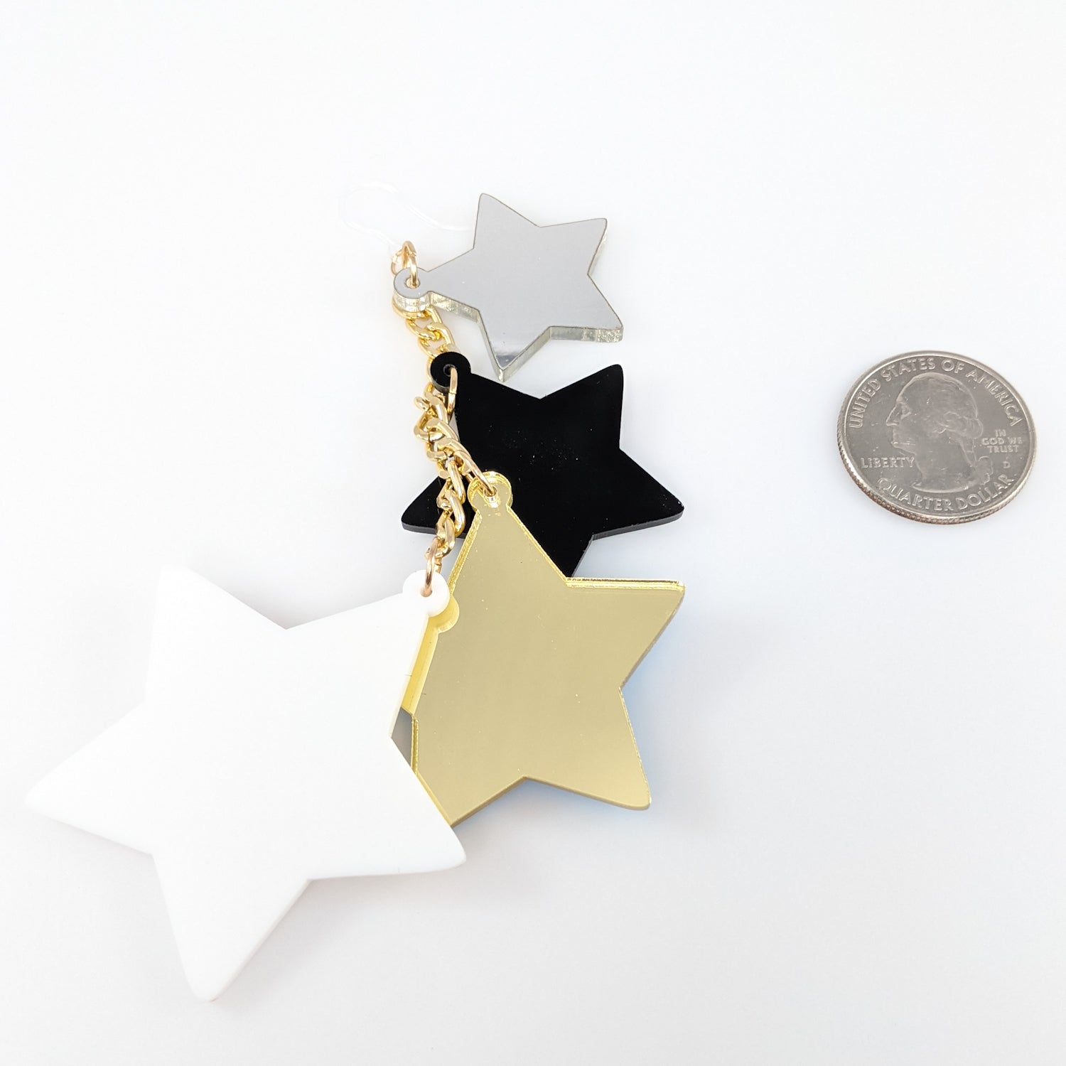 Exaggerated Stars Earrings (Dangles) - size comparison quarter