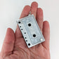 Exaggerated Cassette Tape Earrings (Dangles) - white - size comparison hand