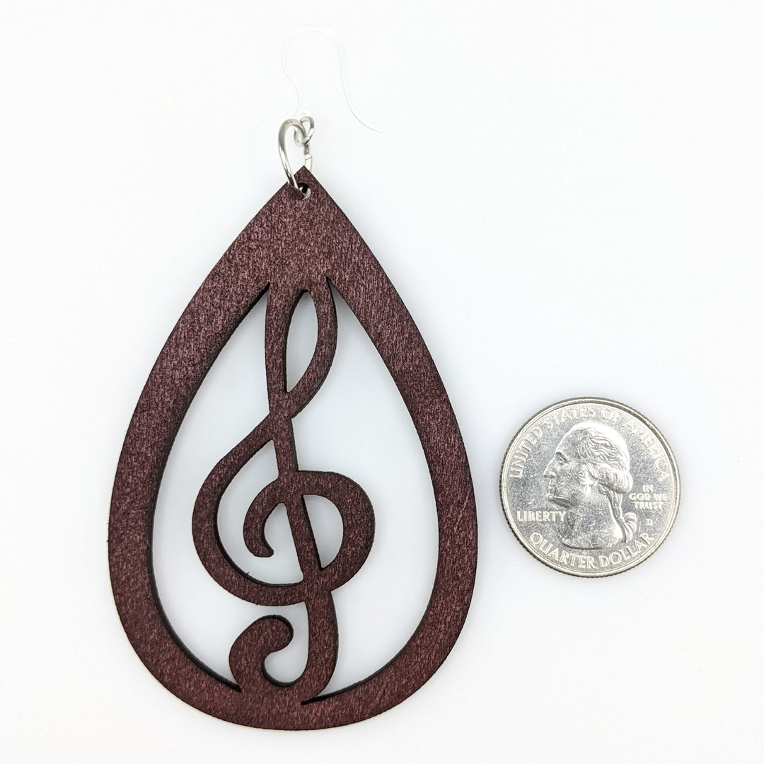 Exaggerated Wooden Treble Clef Earrings (Dangles) - size comparison quarter