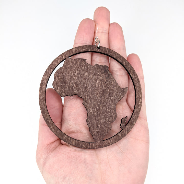 Exaggerated Framed Wooden Africa Earrings (Dangles) - size comparison hand