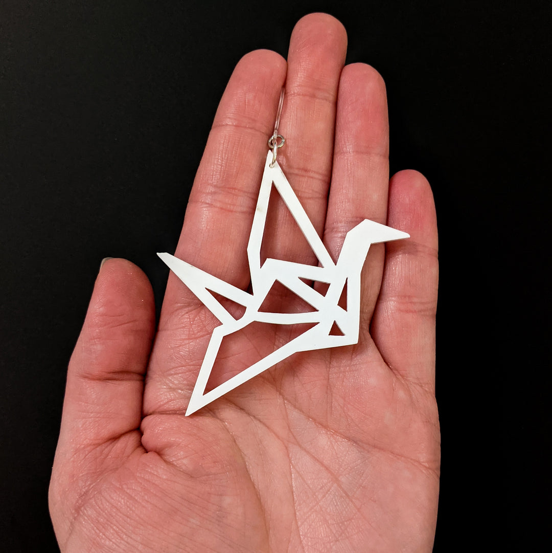 Exaggerated Origami Crane Earrings (Dangles) - size comparison hand