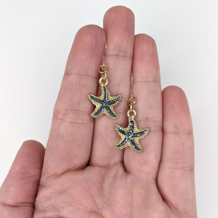 Glittery Starfish Earrings (Dangles)- size comparison hand