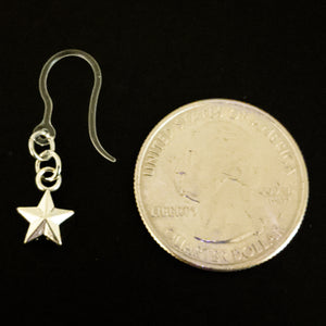 Tiny Silver Star Earrings (Dangles) - size comparison quarter