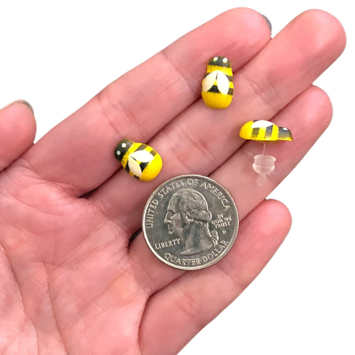 Wooden Bee Earrings (Studs) - size comparison quarter & hand