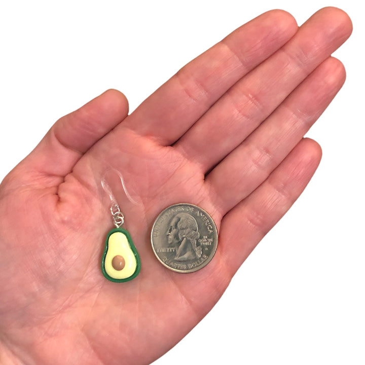 Avocado Halves Earrings (Dangles) - size comparison quarter & hand