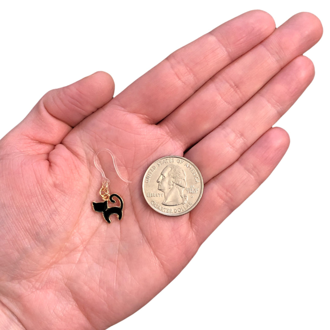 Tiny Black Cat Earrings (Dangles) - size comparison quarter & hand