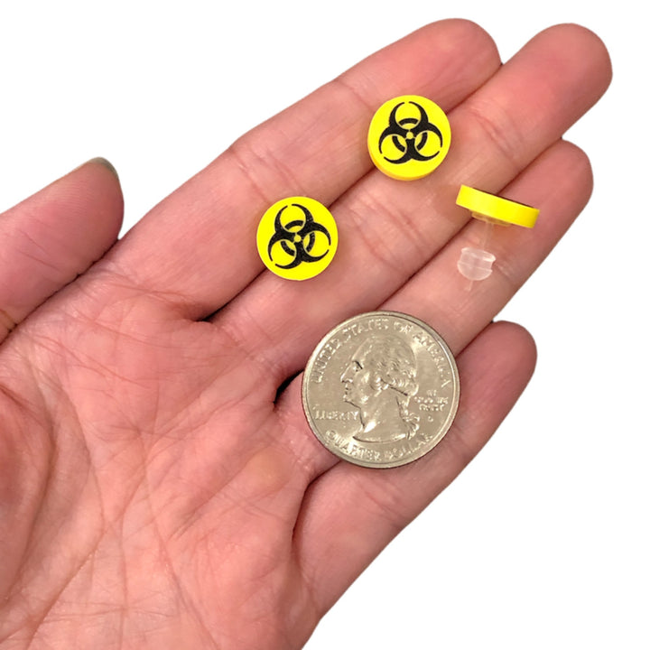 Biohazard Earrings (Studs) - size comparison quarter & hand
