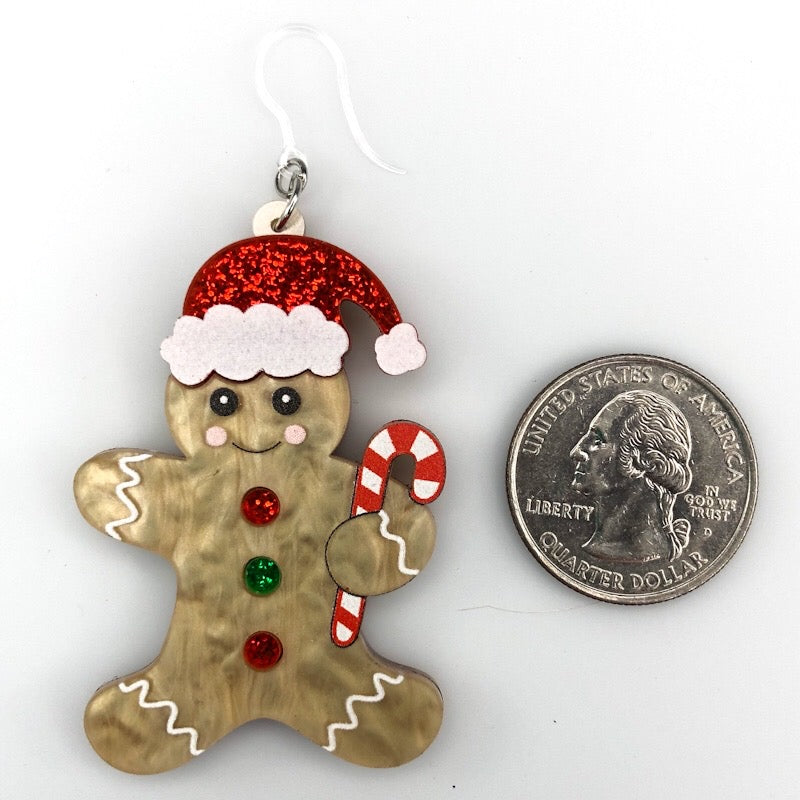 Exaggerated Gingerbread Man Earrings (Dangles) - size comparison quarter